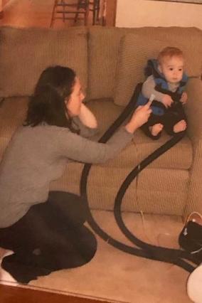 Waylon's mom, Stacy, and Waylon as an infant wearing his breathing treatment vest.