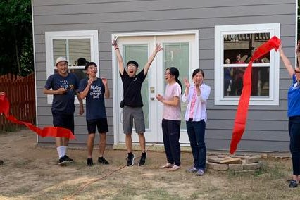 Manny and his family celebrating at the ribbon cutting for his wish