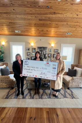 The Big Rock finishing tournament presenets a check to Make-A-Wish Eastern North Carolina