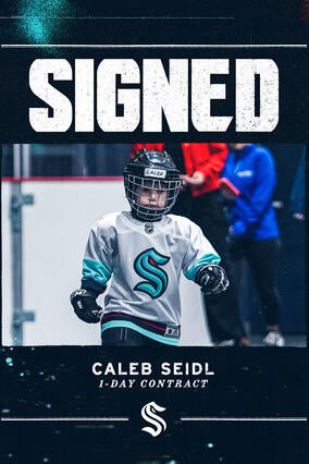 Photo of Caleb in Kraken gear with SIGNED copy on it