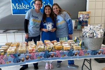 Tara with wish kid Natalee at her wish reveal