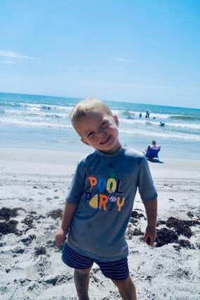 Knox smiling at the beach in Florida