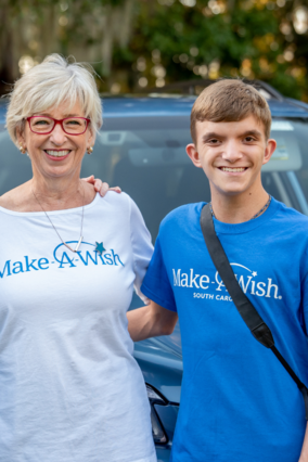 Volunteer Lorraine with wish kid, Colton.
