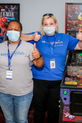 Volunteers set up Everett's game room wish.