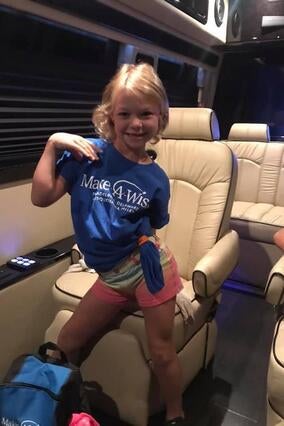 Wish kid Arden in a limo