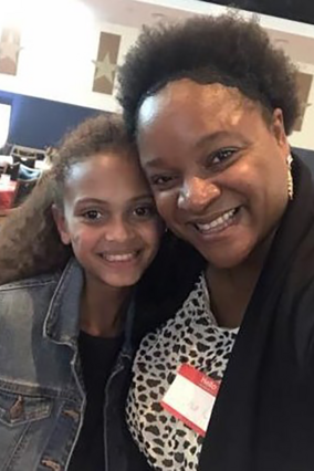 Volunteer Sophia with a wish kid