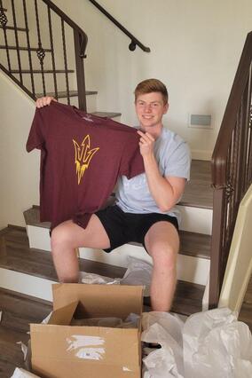 Zac unboxing items from his wish reveal.