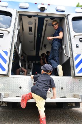 child climbs into back of ambulance