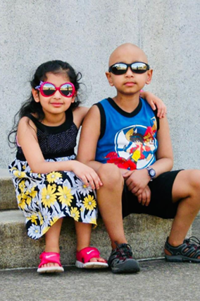 Neel during cancer treatment with his sister Neha