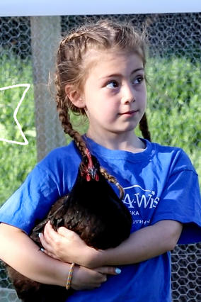 Wish Kid Aspen_holding chicken_Nebraska