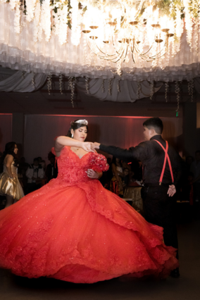 Emely dances with one of her chambelanes