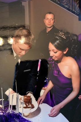 Wish kid Nicole in a purple dress cutting the cake at her party. 