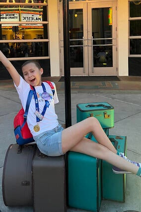 Azul celebrating the end of her leukemia treatments on her wish.