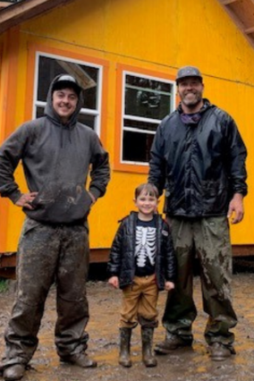 Uriah and Urban Lumber stand outside of the Music House