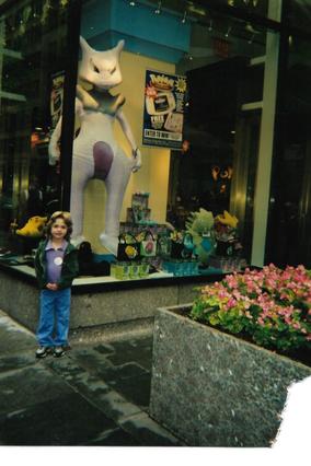 Amelia in front of Pokemon Center Facade 