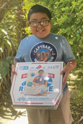 Wish Kid Titus receiving a pizza with his face on it