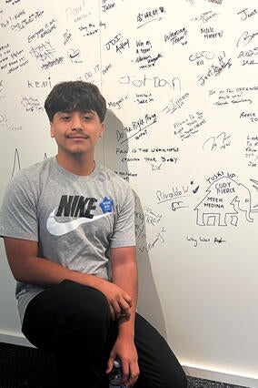 Derek in front of the Nike wall