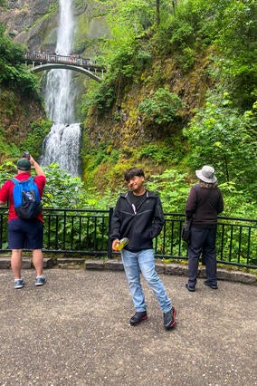 Derek in front of a waterfall