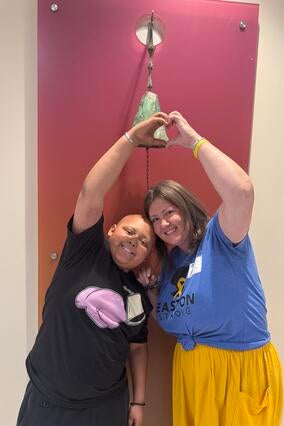 Easton and his mom ring the bell