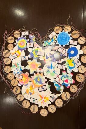 Participants make a heart with their name wood cookies
