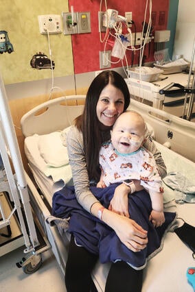 Andrew and his mom in the hospital