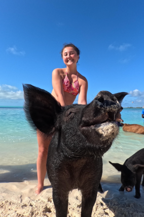 Addison swims with pigs portrait