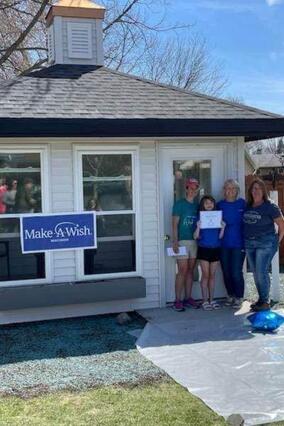 Wish kid Sophia standing in front of her new gazebo