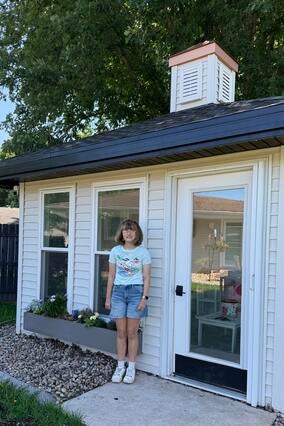 Wish Alum Sophia standing in front of her gazebo now