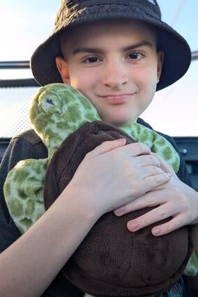 Zane with stuffed turtle