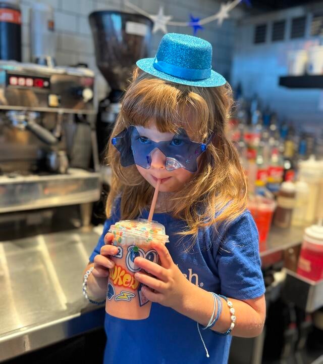 Wish Kid Abigail drinking Dutch Bros