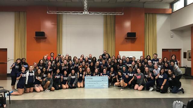 Tau Beta Sigma of The University of Texas at Austin presenting their $5,000 check to Make-A-Wish CSTX.