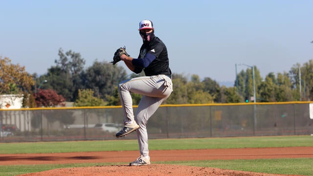 Jack Delmore winds up for a pitch on the baseball field