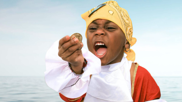 Areice, dressed as a pirate, finds treasure
