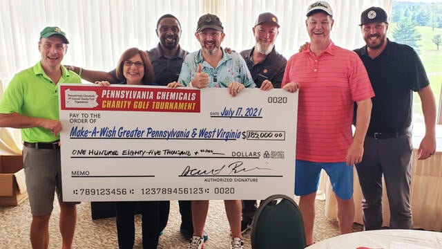 Pennsylvania Chemicals Golf Outing members presenting donation at the event.