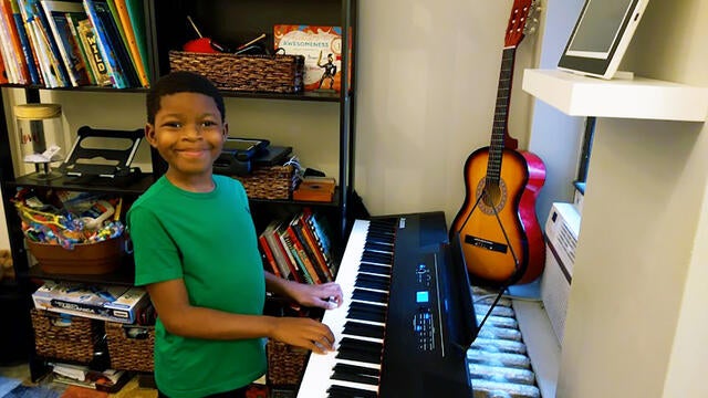 Wish Kid Kai at keyboard