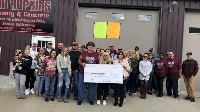 Jim Hopkins Masonry & Concrete present their donation to Make-A-Wish.