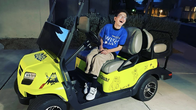 John and Yoon helped grant Ethan's wish to have a golf cart