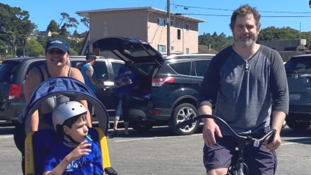 Elijah and parents bike riding