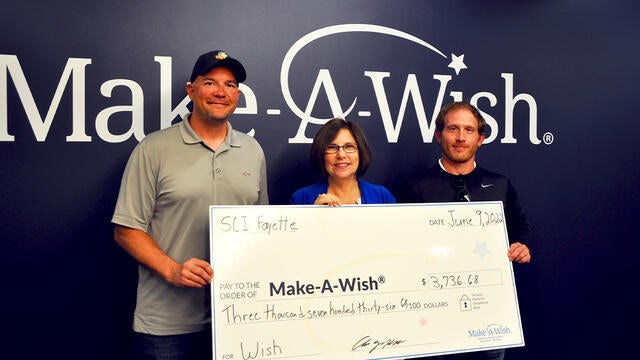 Anthony Holt, Corrections Activities Manager and Jake Knepper, Activities Specialist with Stephanie Pugliese, Make-A-Wish Development Director