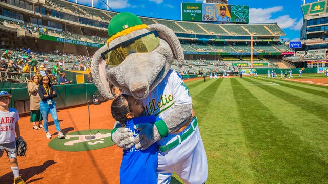 Wish kid hugging mascot