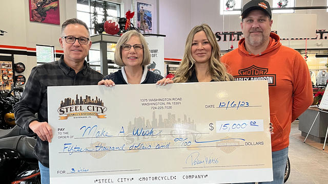 associates of Steel City Harley-Davidson with General Manager, Pokey Weiss and Marketing Director and Event Coordinator Lisa Bakaysza-Cepaiti presenting Director of Development Stephanie Pugliese with a check totaling $15,000.