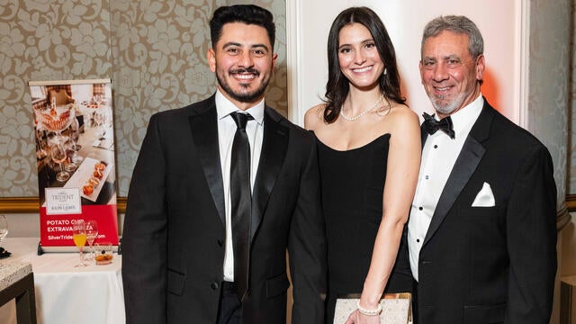 Guests Anthony Sammut, Abby Manley and George Sammut enjoy the cocktail reception at the 2024 Evening of Wishes: Birthday Bash.