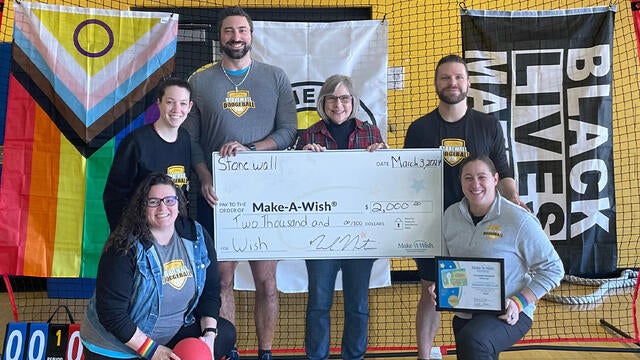 A check presentation from representatives of Stonewall Dodgeball Pittsburgh.