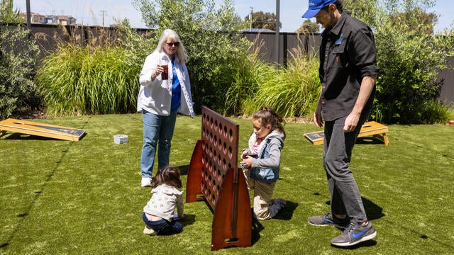 Wish families enjoying the sun and playing games at the Wish It Forward Reunion on April 27.