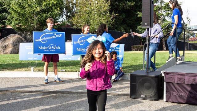 Wish kid Bridget after her wish reveal at Walk for Wishes