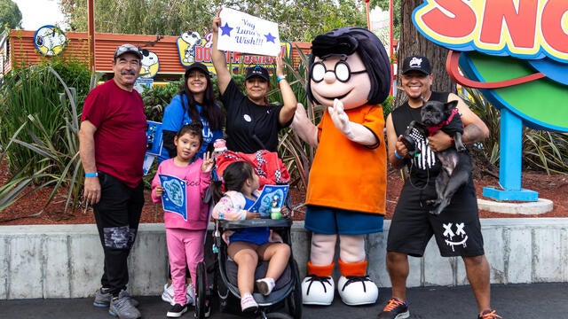 Peanuts character Marci with walkers at Walk for Wishes