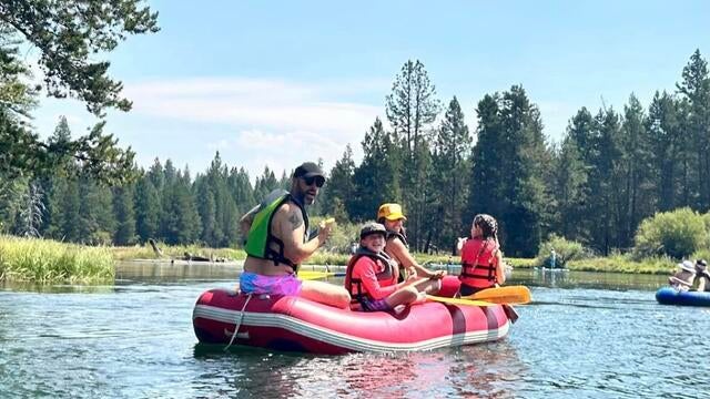 family on a boat out on the water