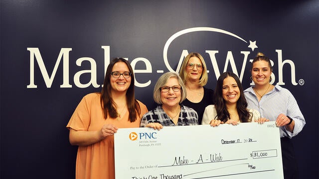Pictured is Stephanie Pugliese, director of development with the PNC Treasury Management Golf Committee lead by chair Charlee Brindza making a presentation of $31,000. 