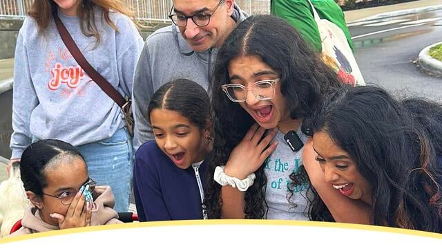 The Faruqui Family reacts with surprise and excitement learning that their family won the "Indominable Spirit" award.