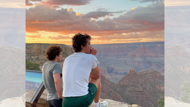 Emlen and his brother looking out over the Grand Canyon at sunset